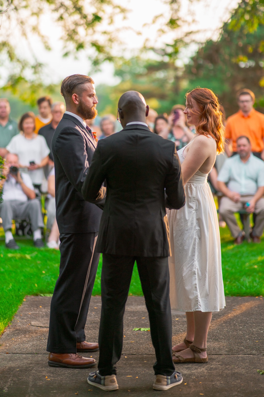Outdoor wedding ceremony seen over the guests