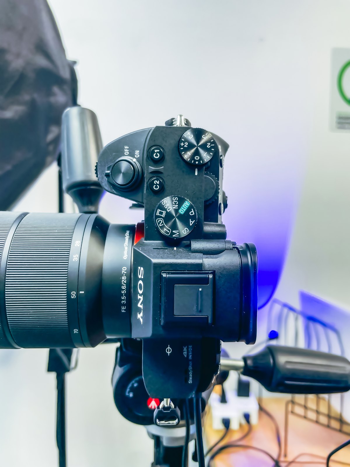 Sony mirrorless camera on a stand beside a softbox