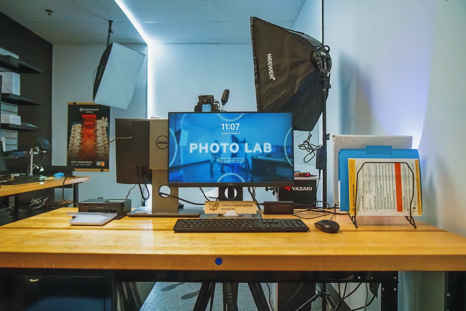 Camera on a stand in front of a monitor showing the Photo Lab screen