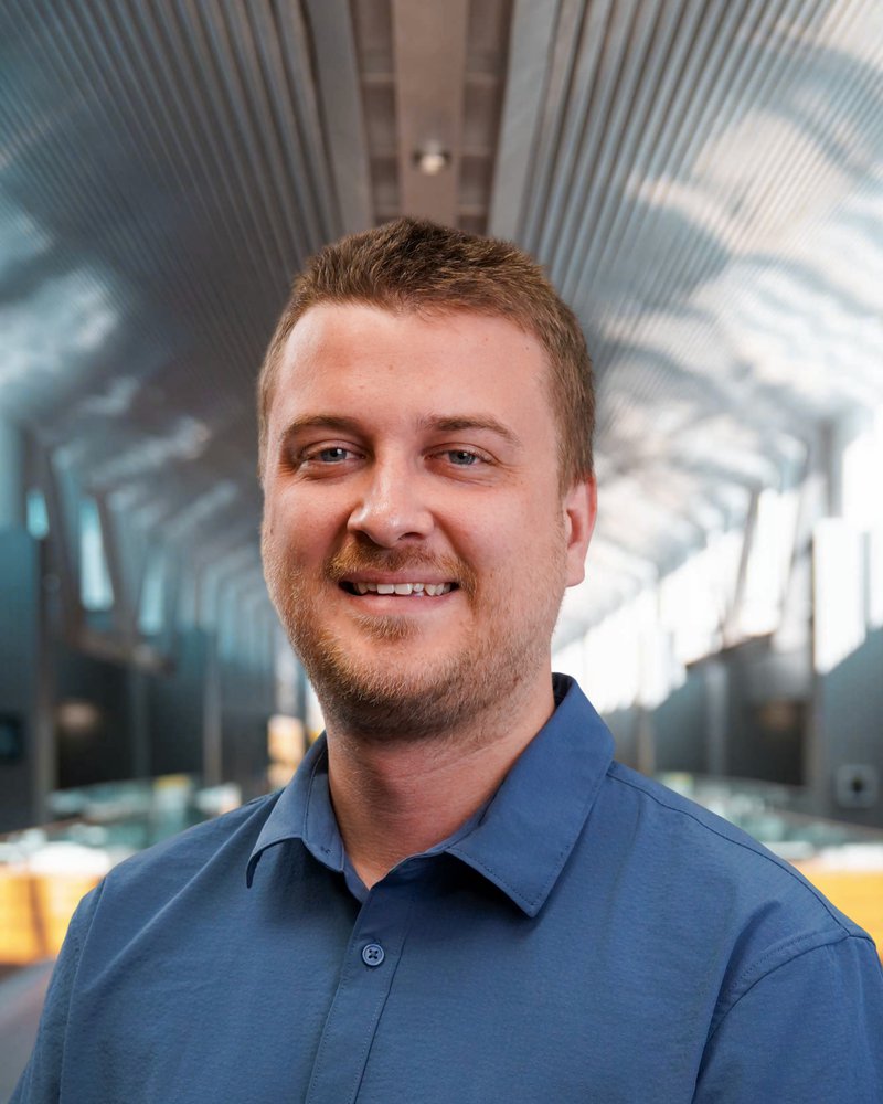 Employee headshot taken in the self-serve Photo Lab studio