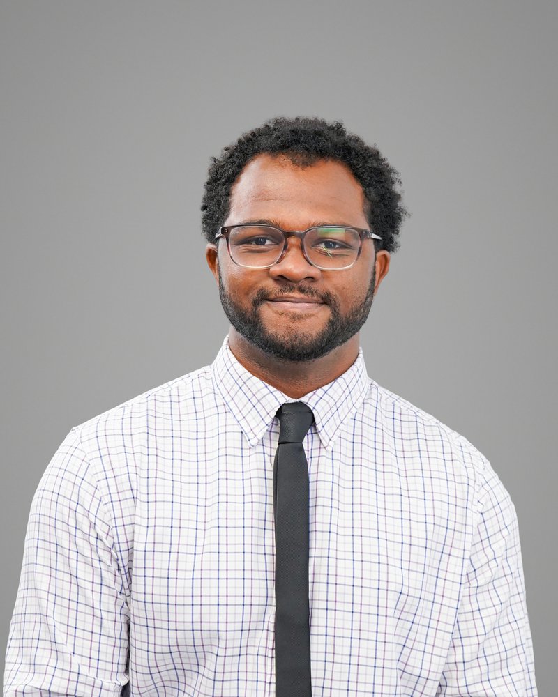 Employee headshot taken in the self-serve Photo Lab studio