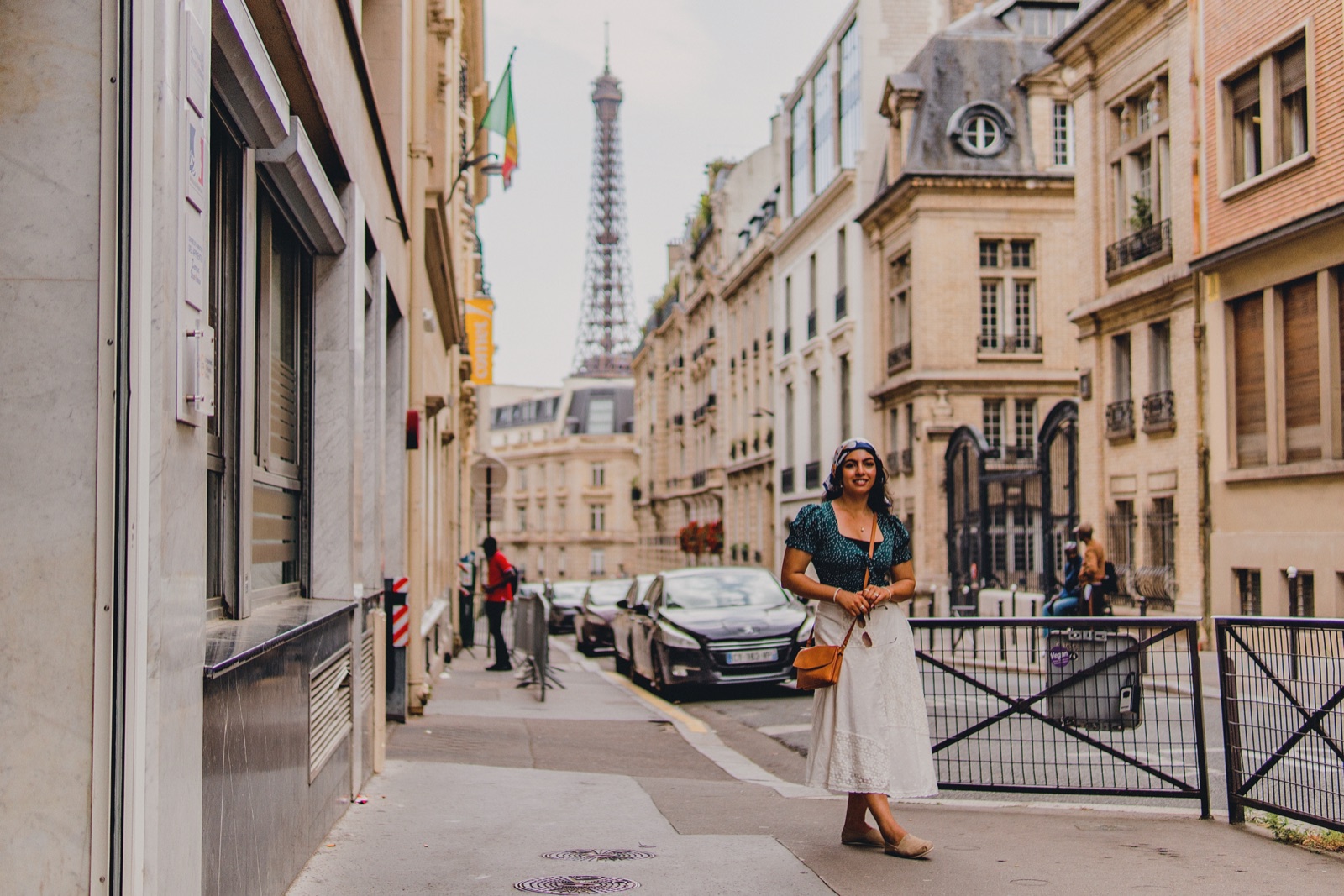Woman on a Paris street with the Eiffel Tower behind